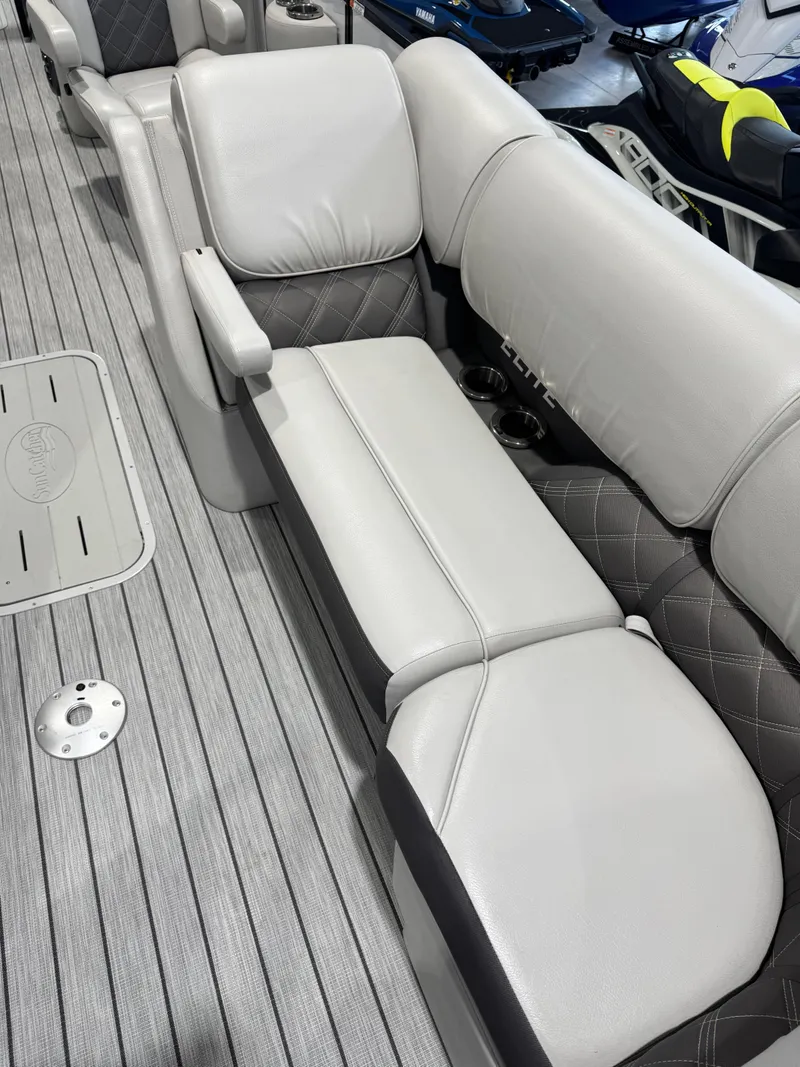 Slide: The Image of 2024 G3 Elite 324RC boat interior with gray cushioned seating and textured flooring. - 4