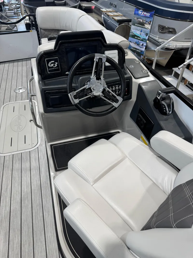 Slide: The Image of 2024 G3 Elite 324RC boat interior with steering wheel and plush seating. - 8