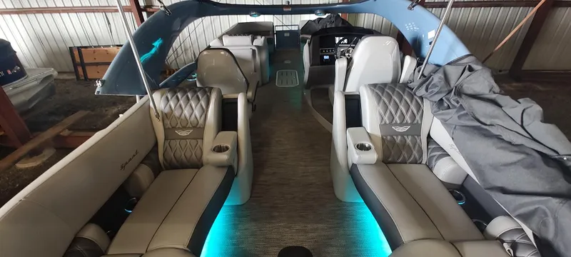 Slide: The Image of 2021 Bennington RX 25 RXFBA pontoon boat interior with luxurious seating and ambient lighting. - 19
