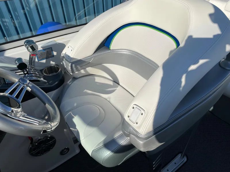 Slide: The Image of 2018 Formula 292 FASTech boat interior with steering wheel and cushioned seat. - 13