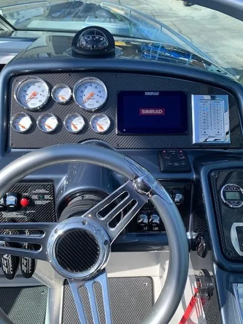 Slide: The Image of Dashboard of a 2018 Formula 292 FASTech boat with gauges and Simrad display. - 15