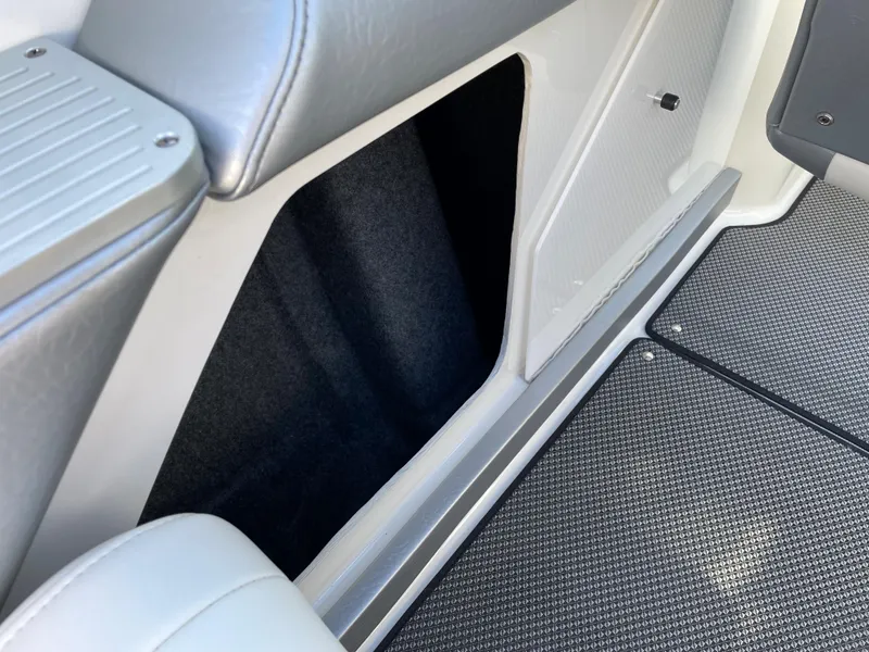 Slide: The Image of Interior of a 2018 Formula 292 FASTech boat, featuring seating and carpeted flooring. - 17