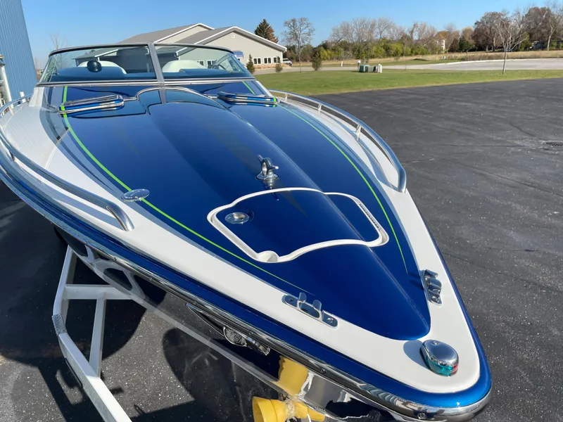 Slide: The Image of 2018 Formula 292 FASTech boat with sleek blue and white design on display. - 2