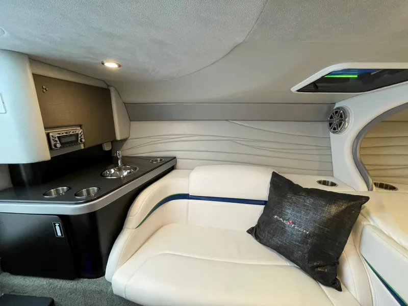 Slide: The Image of 2018 Formula 292 FASTech cabin interior with white seating, sink, and stereo system. - 21