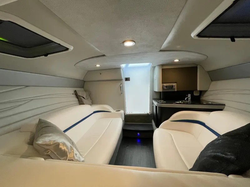 Slide: The Image of 2018 Formula 292 FASTech cabin interior with white seating and kitchenette. - 28
