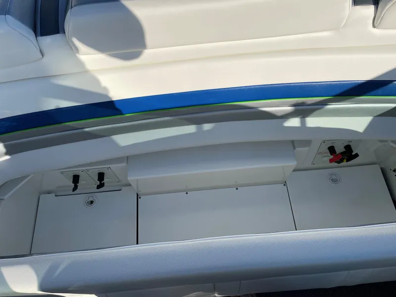 Slide: The Image of 2018 Formula 292 FASTech boat interior storage compartment with white and blue accents. - 32