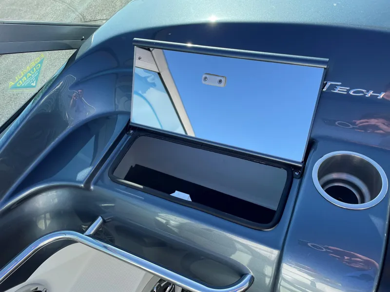 Slide: The Image of 2018 Formula 292 FASTech boat dashboard with storage compartment and cup holder. - 36