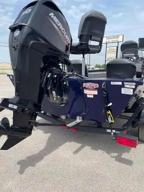 Slide: The Image of 2020 Tracker Pro 170 boat with Mercury outboard motor in parking lot. - 10