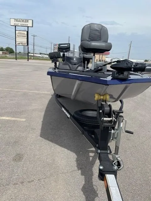 Slide: The Image of 2020 Tracker Pro 170 boat on trailer in parking lot, with visible dealership sign. - 7