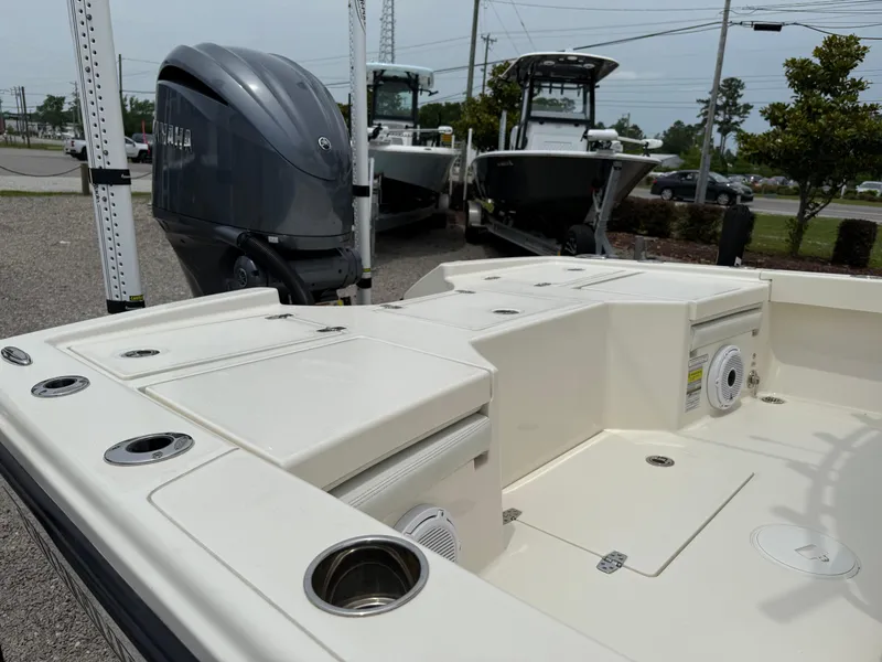 Slide: The Image of 2023 Pathfinder 2500 Hybrid boat with Yamaha outboard motor, docked outdoors. - 15