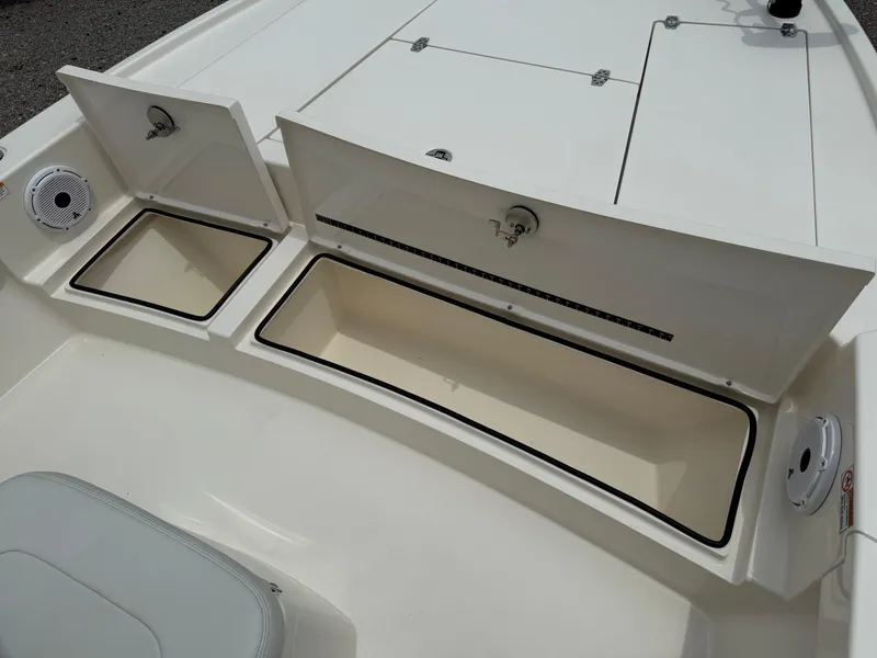 Slide: The Image of 2023 Pathfinder 2500 Hybrid boat storage compartments open on deck. - 17