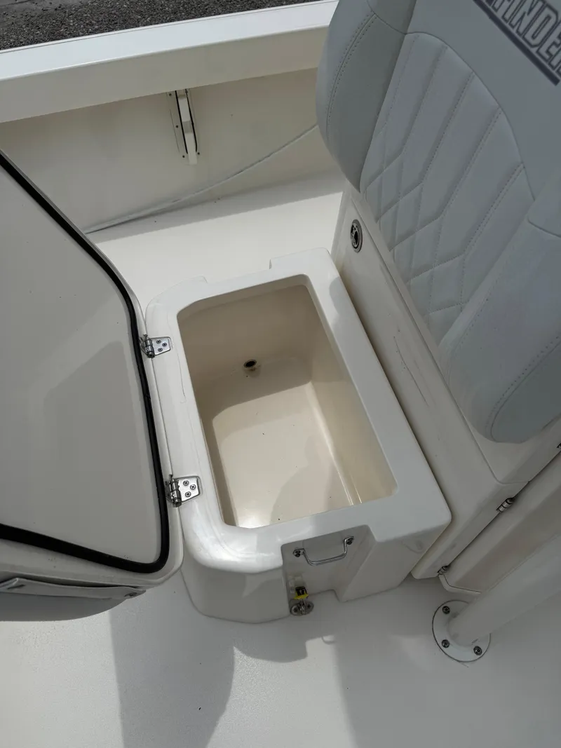Slide: The Image of 2023 Pathfinder 2500 Hybrid boat seat with open storage compartment. - 18