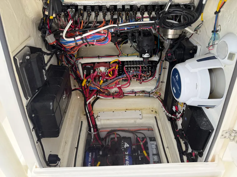 Slide: The Image of 2023 Pathfinder 2500 Hybrid electrical compartment with wiring and battery setup. - 19