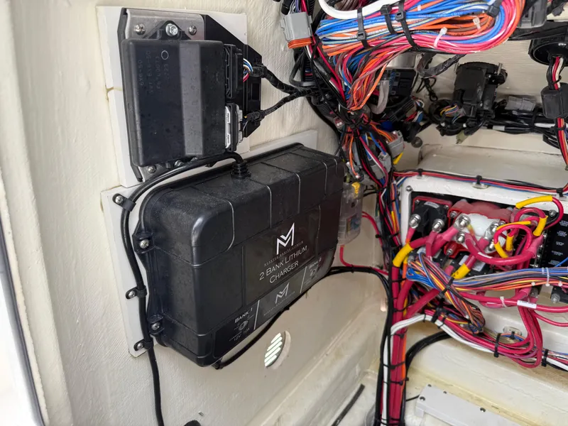 Slide: The Image of Electrical wiring and components inside a 2023 Pathfinder 2500 Hybrid boat. - 22