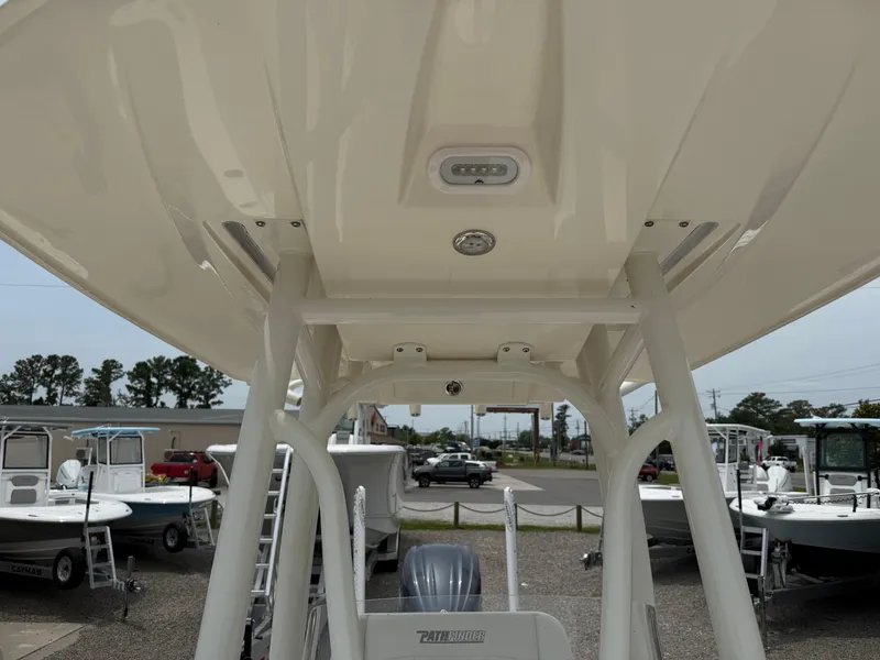 Slide: The Image of 2023 Pathfinder 2500 Hybrid boat, view of the T-top and console area. - 23