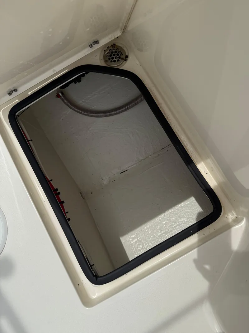 Slide: The Image of Open storage compartment in 2023 Pathfinder 2500 Hybrid boat. - 34