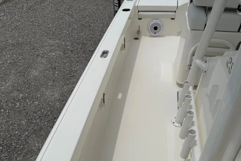 Slide: The Image of 2023 Pathfinder 2500 Hybrid boat interior with rod holders and clean deck design. - 37