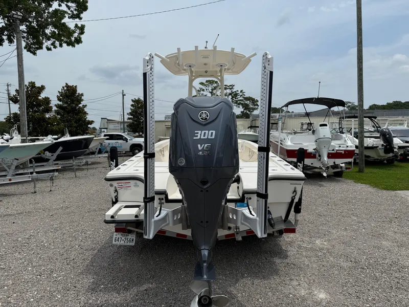 Slide: The Image of 2023 Pathfinder 2500 Hybrid boat with Yamaha 300 HP engine, parked on gravel lot. - 4