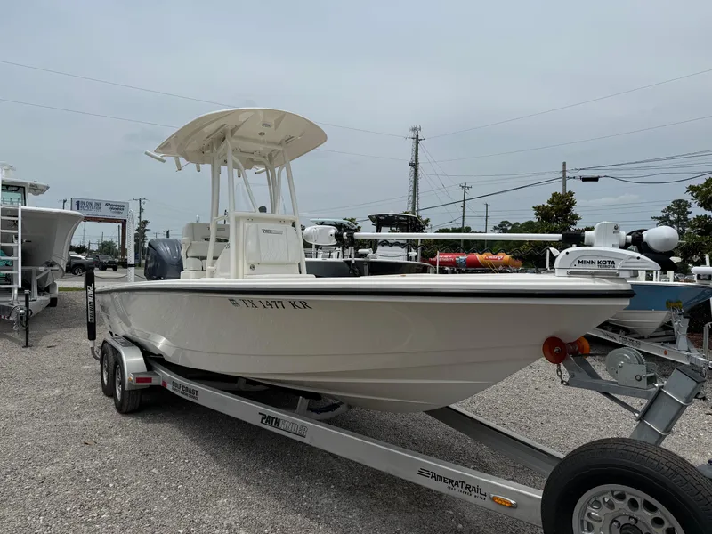 Slide: The Image of 2023 Pathfinder 2500 Hybrid boat on trailer in outdoor dealership lot. - 7