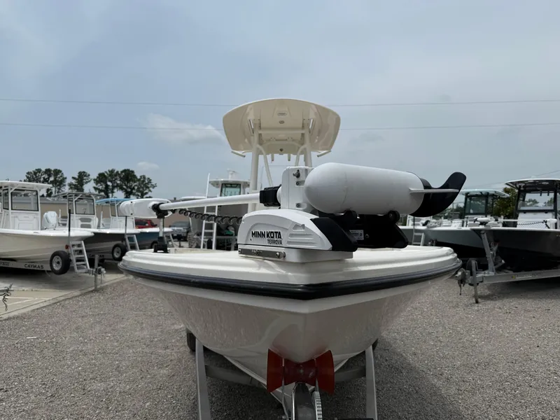 Slide: The Image of 2023 Pathfinder 2500 Hybrid boat with Minn Kota trolling motor, parked on gravel. - 9