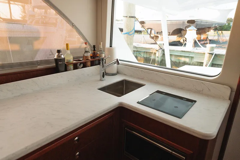 Slide: The Image of Luxurious 2022 Composite Yacht CY46 kitchen with marble countertop and modern appliances. - 14