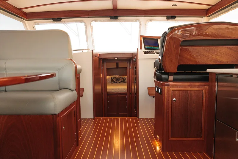 Slide: The Image of Luxurious interior of 2022 Composite Yacht CY46 with elegant wood finishes and modern seating. - 17