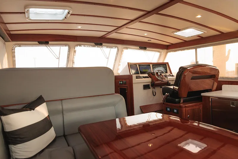 Slide: The Image of Luxurious interior of 2022 Composite Yacht CY46 with elegant wood finishes and modern seating. - 20