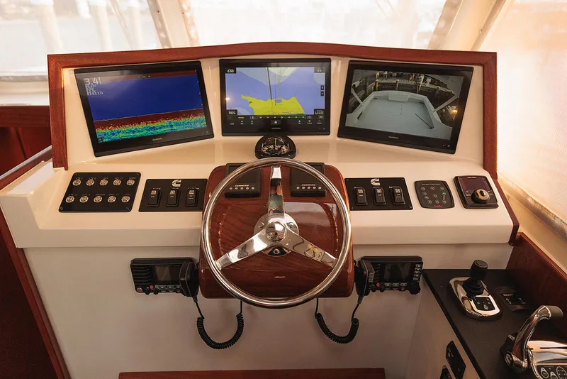 Slide: The Image of Helm of 2022 Composite Yacht CY46 with advanced navigation displays and controls. - 21