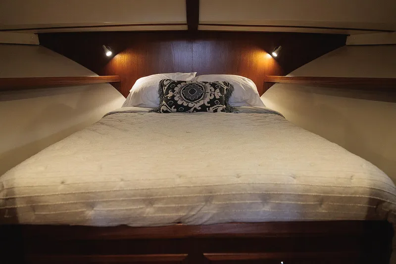 Slide: The Image of Luxurious bedroom interior of 2022 Composite Yacht CY46 with elegant bedding and ambient lighting. - 22