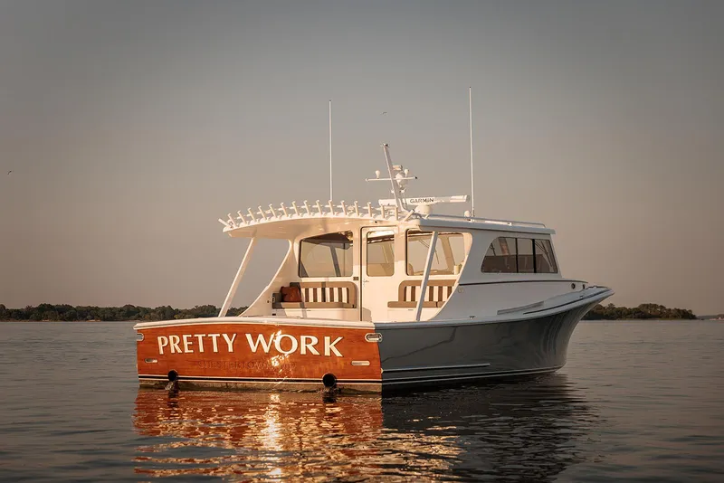 Slide: The Image of Composite Yacht CY46, 2022 model, named "Pretty Work" on calm water at sunset. - 3