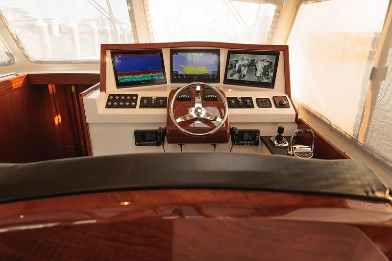 Slide: The Image of Helm of 2022 Composite Yacht CY46 with navigation screens and controls. - 5