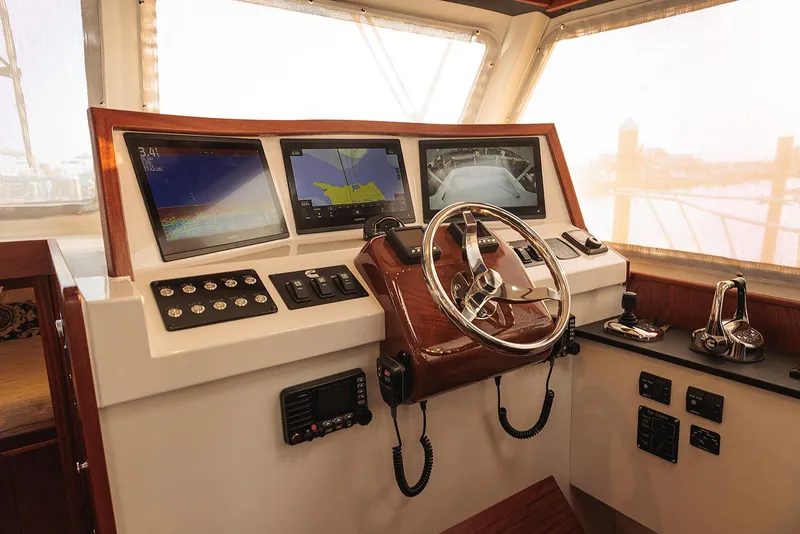 Slide: The Image of Helm of 2022 Composite Yacht CY46 with navigation screens and controls. - 6