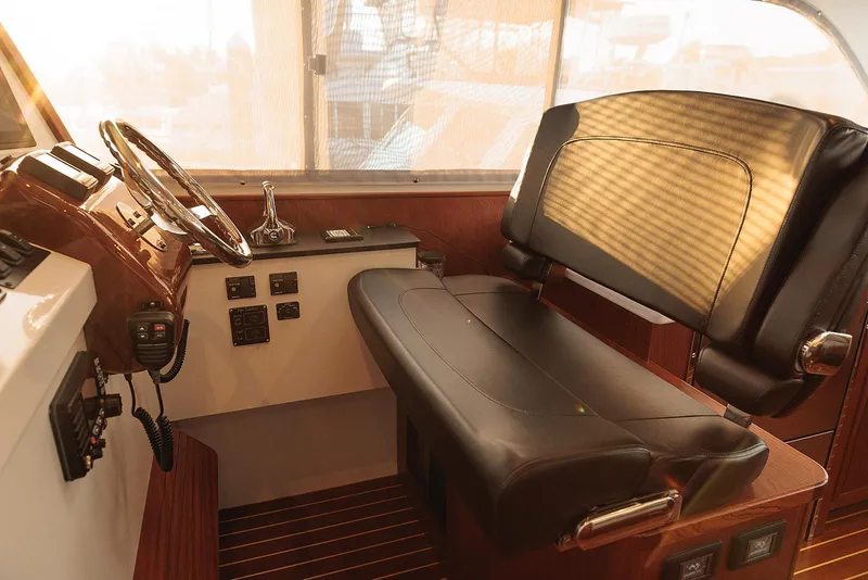 Slide: The Image of Cockpit of 2022 Composite Yacht CY46 with leather seating and control panel. - 9