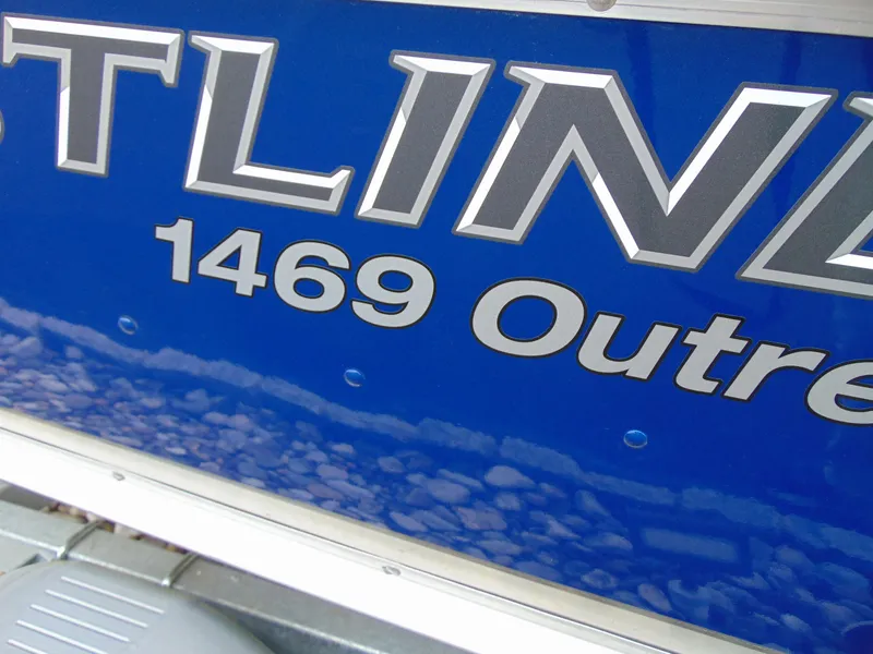 Slide: The Image of 2024 Crestliner 1469 Outreach boat nameplate on blue background. - 11