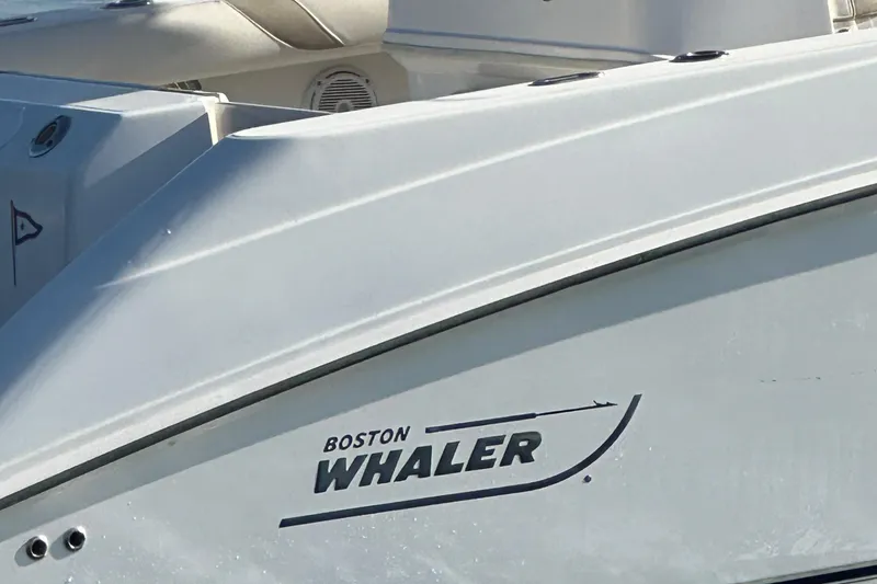 Slide: The Image of Boston Whaler 270 Outrage 2004 boat side view with logo visible. - 12