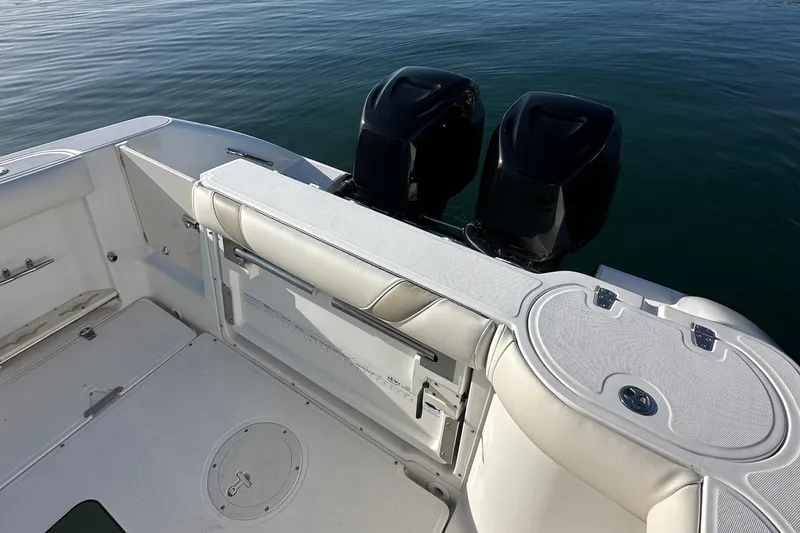 Slide: The Image of 2004 Boston Whaler 270 Outrage boat with dual engines on calm water. - 20