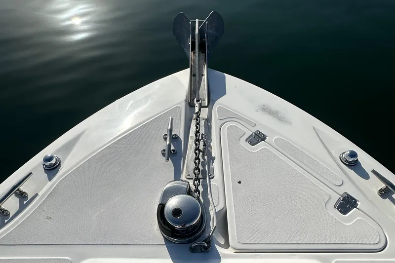 Slide: The Image of Bow of 2004 Boston Whaler 270 Outrage with anchor and chain mechanism. - 22