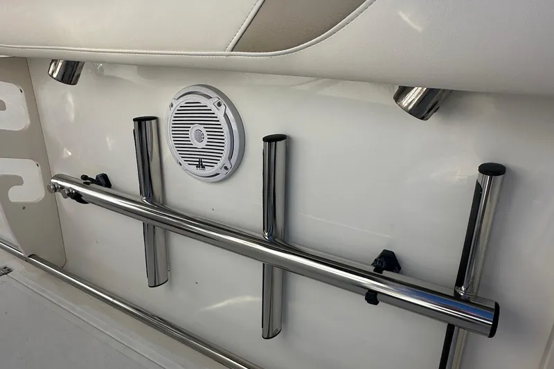 Slide: The Image of Boston Whaler 270 Outrage 2004 boat interior with rod holders and speaker. - 25