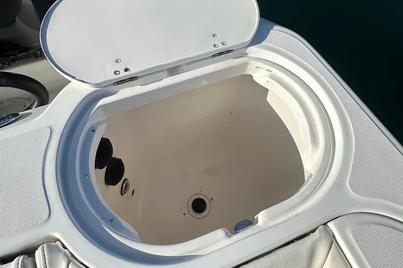 Slide: The Image of Open storage compartment on a 2004 Boston Whaler 270 Outrage boat. - 28