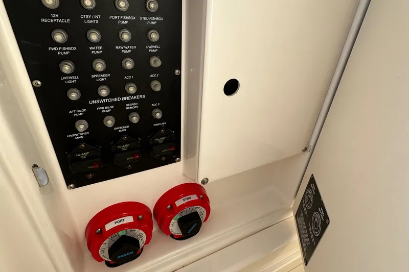 Slide: The Image of Control panel and switches on a 2004 Boston Whaler 270 Outrage boat. - 31