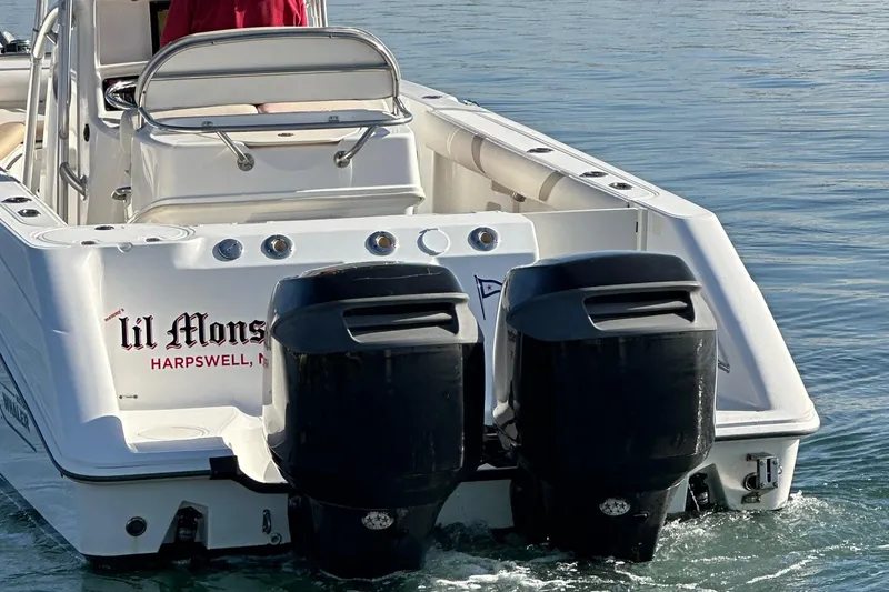 Slide: The Image of 2004 Boston Whaler 270 Outrage boat with dual engines on water. - 9