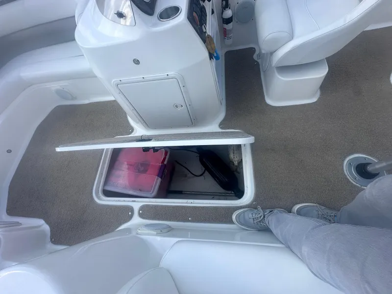 Slide: The Image of Interior of a 2012 Hurricane SD 201 boat with open storage compartment. - 10