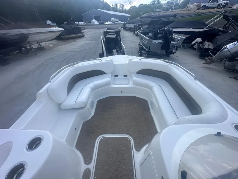Slide: The Image of 2012 Hurricane SD 201 boat interior with spacious seating and carpeted floor. - 12
