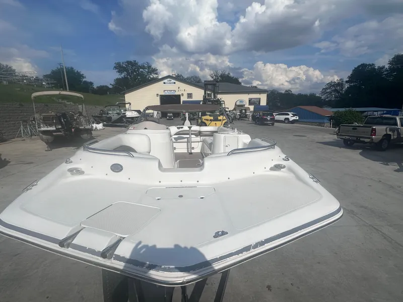 Slide: The Image of 2012 Hurricane SD 201 boat in a marina with cloudy sky background. - 5