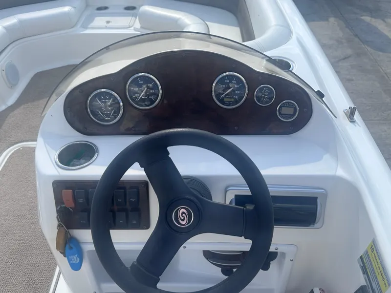 Slide: The Image of Steering wheel and dashboard of a 2012 Hurricane SD 201 boat. - 8