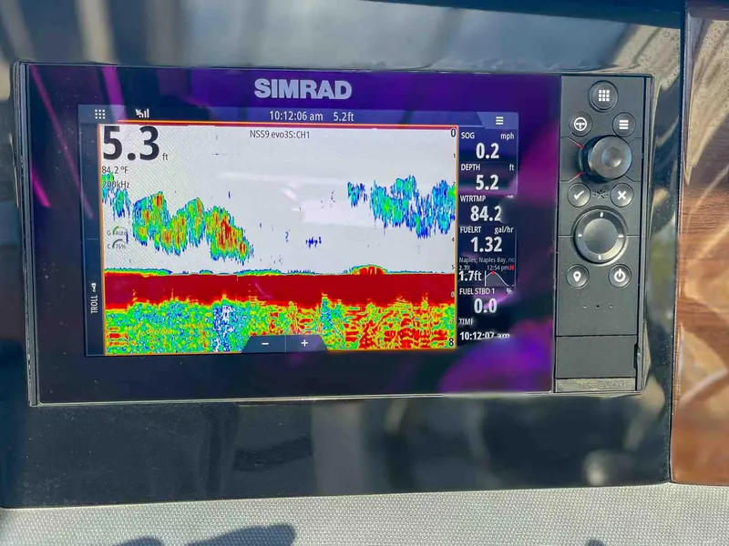 Slide: The Image of Simrad fish finder display on 2021 Chaparral 300 OSX boat, showing depth and sonar data. - 12