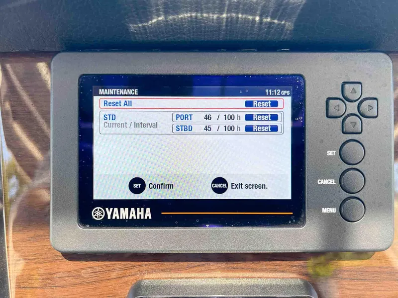 Slide: The Image of Yamaha maintenance screen on 2021 Chaparral 300 OSX boat, showing engine hours and reset options. - 13