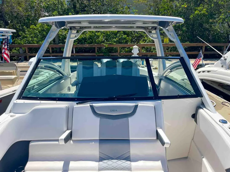 Slide: The Image of 2021 Chaparral 300 OSX boat with sleek design and spacious seating area. - 22