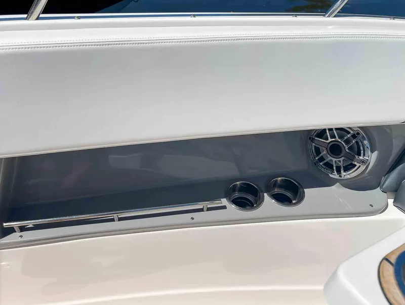 Slide: The Image of Interior detail of 2021 Chaparral 300 OSX boat with speaker and cup holders. - 28
