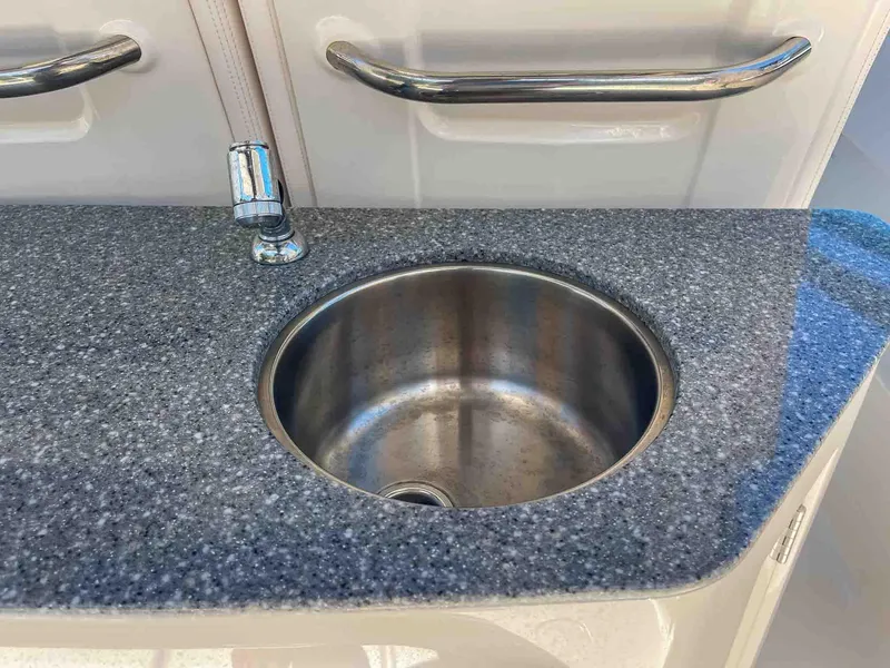 Slide: The Image of Stainless steel sink on 2021 Chaparral 300 OSX boat with granite countertop. - 35